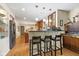 Modern kitchen with a breakfast bar and stainless steel appliances at 595 Hawthorne Dr, Carmel, IN 46033