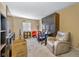Cozy living room featuring a comfortable armchair and wall unit at 595 Hawthorne Dr, Carmel, IN 46033
