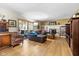 Open living space with a sectional sofa and access to the backyard at 595 Hawthorne Dr, Carmel, IN 46033