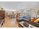 Spacious living room with a leather sectional and kitchen views at 595 Hawthorne Dr, Carmel, IN 46033