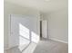 Bedroom with neutral walls, carpet, and double sliding closet doors at 7149 Rose Hill Ave, Brownsburg, IN 46112