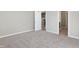 Bedroom with carpet and views into kitchen at 7149 Rose Hill Ave, Brownsburg, IN 46112