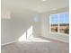 Spacious bedroom with large window and carpet at 7149 Rose Hill Ave, Brownsburg, IN 46112