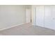 Bedroom with neutral walls, carpet, and access to another room at 7149 Rose Hill Ave, Brownsburg, IN 46112
