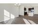 Open concept dining room with kitchen view and chandelier at 7149 Rose Hill Ave, Brownsburg, IN 46112