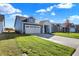 Two-story home with blue siding, white trim, and a two-car garage at 7149 Rose Hill Ave, Brownsburg, IN 46112
