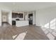 Modern kitchen with dark cabinets and a large island at 7149 Rose Hill Ave, Brownsburg, IN 46112