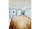 Spacious finished basement with hardwood floors and exposed beams at 2442 N Franklin Rd, Indianapolis, IN 46219