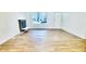 Bright living room with hardwood floors, a fireplace, and a view of the street at 2442 N Franklin Rd, Indianapolis, IN 46219
