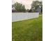 Private backyard with a white fence and grassy lawn at 11155 Baywood Ln, Indianapolis, IN 46236