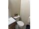 Small bathroom with a toilet and sink at 11155 Baywood Ln, Indianapolis, IN 46236