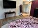 Spacious Primary bedroom with hardwood floors and large TV at 11155 Baywood Ln, Indianapolis, IN 46236