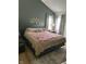 Bedroom with a queen-size bed and dark-green walls at 11155 Baywood Ln, Indianapolis, IN 46236