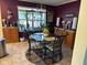 Breakfast nook with a round glass table and four chairs at 11155 Baywood Ln, Indianapolis, IN 46236