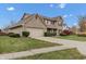 Two-story brick home with red shutters and an attached garage at 12564 Geist Cove Dr, Indianapolis, IN 46236