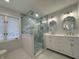 Bathroom showcasing a double vanity, large walk-in shower, and hexagon tiles at 2413 Griton Ct, Shelbyville, IN 46176