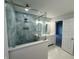 Large bathroom with a walk-in shower, double vanity, and hexagon tile floor at 2413 Griton Ct, Shelbyville, IN 46176