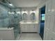 Elegant bathroom with double vanity, hexagon tile, and walk-in shower at 2413 Griton Ct, Shelbyville, IN 46176
