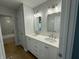 Bathroom with double vanity, quartz countertop and updated lighting at 2413 Griton Ct, Shelbyville, IN 46176
