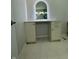 White vanity with a modern arched mirror in a stylish bathroom at 2413 Griton Ct, Shelbyville, IN 46176