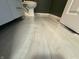Grey marble-look bathroom flooring with a modern design at 2413 Griton Ct, Shelbyville, IN 46176