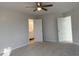 Spacious bedroom with neutral gray carpeting and ceiling fan at 2413 Griton Ct, Shelbyville, IN 46176