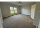 Spacious bedroom with neutral carpeting and a large window at 2413 Griton Ct, Shelbyville, IN 46176