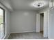 Spacious bedroom with large window, closet, and ceiling fan at 2413 Griton Ct, Shelbyville, IN 46176