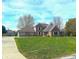 Brick two-story home with landscaped lawn and attached garage at 2413 Griton Ct, Shelbyville, IN 46176