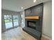 Dark gray brick fireplace with a wooden mantel at 2413 Griton Ct, Shelbyville, IN 46176