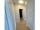 Bright hallway with light gray walls and light wood flooring at 2413 Griton Ct, Shelbyville, IN 46176