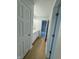 Bright hallway with light wood flooring and access to bedrooms at 2413 Griton Ct, Shelbyville, IN 46176