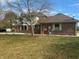 Two-story brick home with attached garage and landscaping at 2413 Griton Ct, Shelbyville, IN 46176