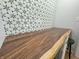 Live-edge wood countertop with a geometric patterned tile backsplash at 2413 Griton Ct, Shelbyville, IN 46176