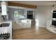 Open concept kitchen with island and view into living room with fireplace at 2413 Griton Ct, Shelbyville, IN 46176