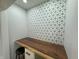 Built-in kitchen nook with a live-edge wood countertop and geometric tile at 2413 Griton Ct, Shelbyville, IN 46176