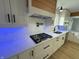 Modern gas cooktop with white shaker cabinets and quartz countertop at 2413 Griton Ct, Shelbyville, IN 46176