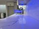 Sleek kitchen sink and faucet with white quartz countertop and blue LED lighting at 2413 Griton Ct, Shelbyville, IN 46176