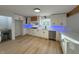 Renovated kitchen with white cabinets, quartz countertops, and stainless steel appliances at 2413 Griton Ct, Shelbyville, IN 46176