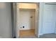 Convenient laundry closet with bifold doors and shelving at 2413 Griton Ct, Shelbyville, IN 46176