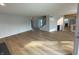 Spacious living room with hardwood floors and views to kitchen and stairs at 2413 Griton Ct, Shelbyville, IN 46176