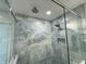Updated shower with blue marble tile and dual shower heads at 2413 Griton Ct, Shelbyville, IN 46176
