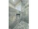 Stunning shower with blue marble-look tile and a built-in niche at 2413 Griton Ct, Shelbyville, IN 46176