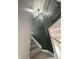 Modern staircase with dark green paneled wall and gray carpeting at 2413 Griton Ct, Shelbyville, IN 46176