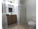 Updated bathroom with modern vanity and shower at 5215 Fawn Hill Ter, Indianapolis, IN 46226