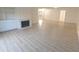 Spacious living room featuring hardwood floors and a fireplace at 5215 Fawn Hill Ter, Indianapolis, IN 46226