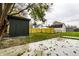 Backyard with shed, artificial turf, and wood fence at 1621 Draper St, Indianapolis, IN 46203