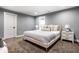 Spacious basement bedroom with a plush bed, nightstands, and ample floor space at 1621 Draper St, Indianapolis, IN 46203