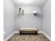 Well-organized basement closet with wire shelving and a convenient bench at 1621 Draper St, Indianapolis, IN 46203