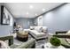 Open concept basement features a L-shape sofa, accent chairs, and a modern coffee table at 1621 Draper St, Indianapolis, IN 46203